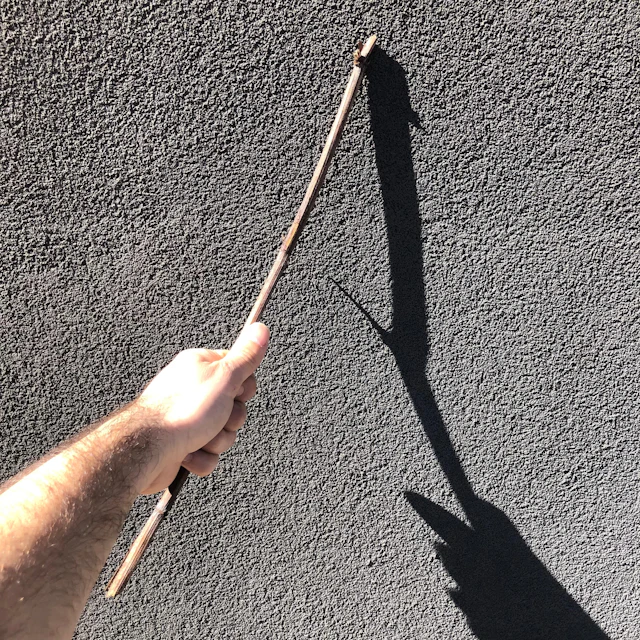 Matthew Hassell - drawing grids with a stick on the walls of a (mostly) empty house